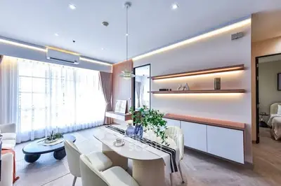 Modern living room with elegant dining area and stylish decor