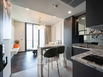 Modern open-layout kitchen with elegant marble countertops and stylish dining area