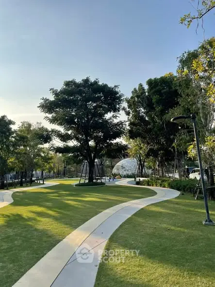 Beautiful landscaped garden with winding paths and lush greenery in a serene residential area.