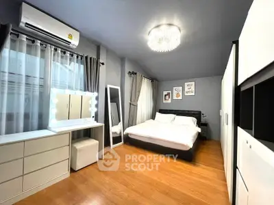 Spacious modern bedroom with elegant decor and ample storage space