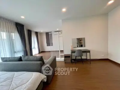 Spacious modern living room with elegant decor and ample natural light