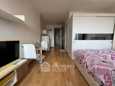 Modern studio apartment with wooden flooring and stylish decor