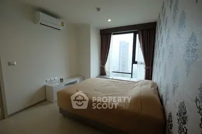 Modern bedroom with city view, featuring stylish wallpaper and air conditioning.