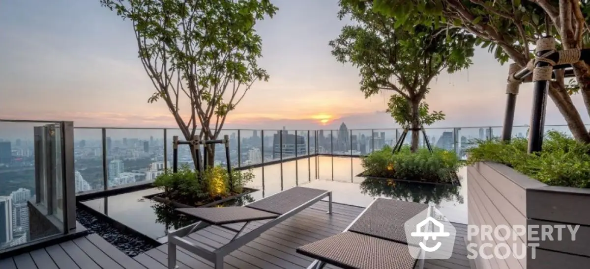 Luxurious rooftop terrace with stunning city skyline view and modern lounge chairs.