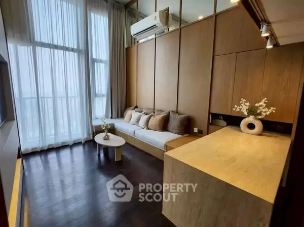 Modern living room with high ceilings and elegant decor