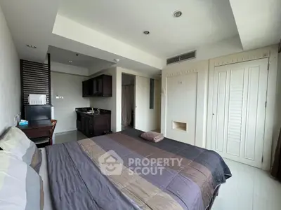 Modern bedroom with integrated kitchenette and sleek design