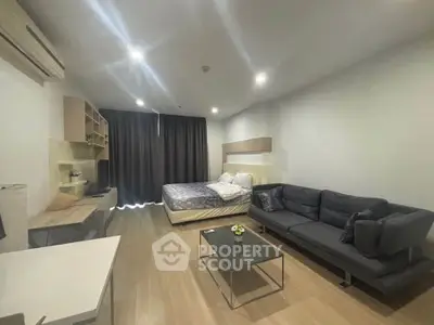 Modern studio apartment with cozy living area and stylish furnishings