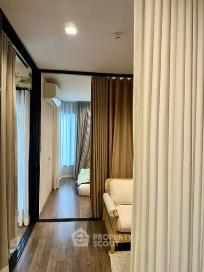 Modern living room with wooden flooring and cozy seating area