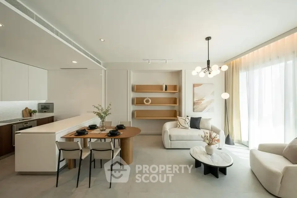 Modern open-plan living room with elegant dining area and stylish kitchen