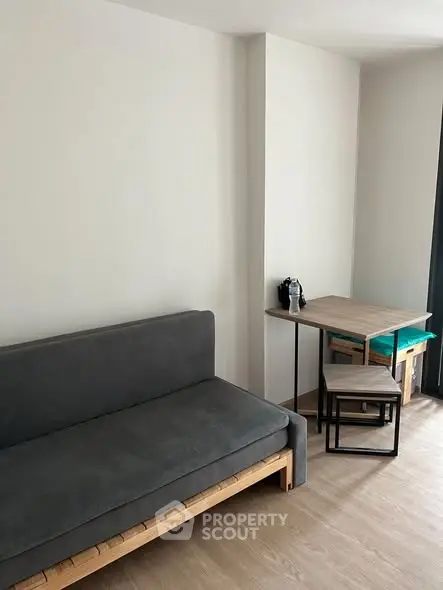 Modern minimalist living room with sleek furniture and natural light