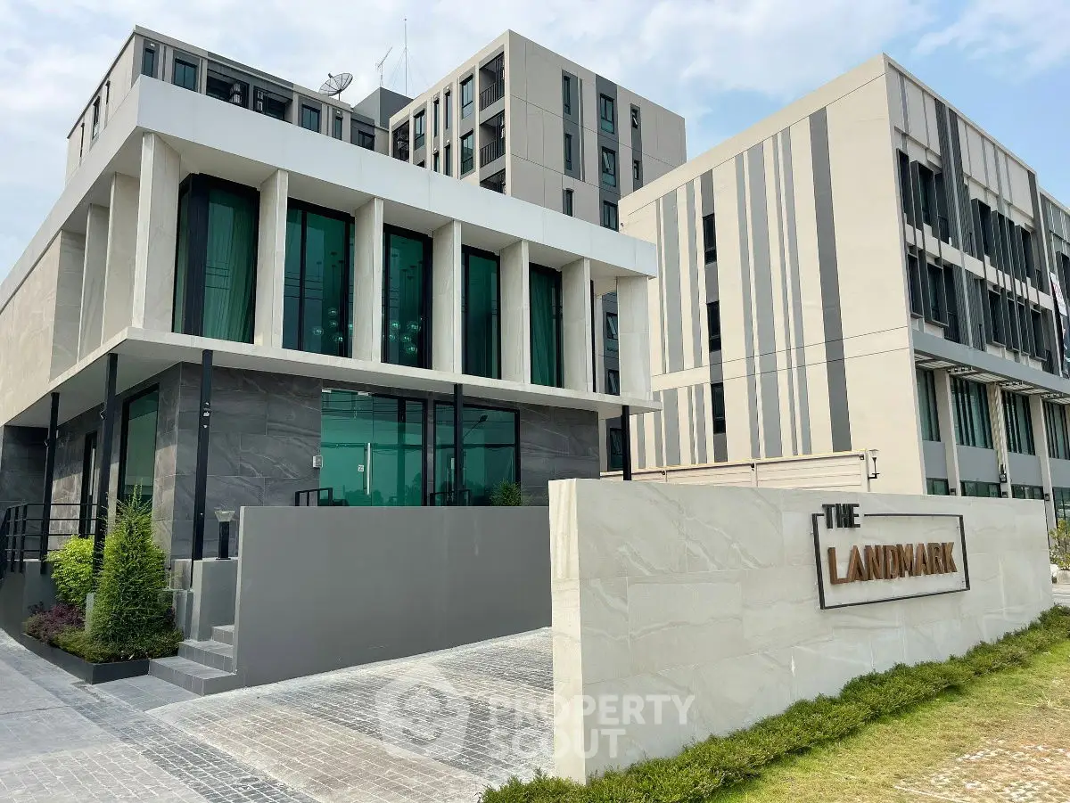 Modern commercial building exterior with sleek design and large windows at The Landmark.