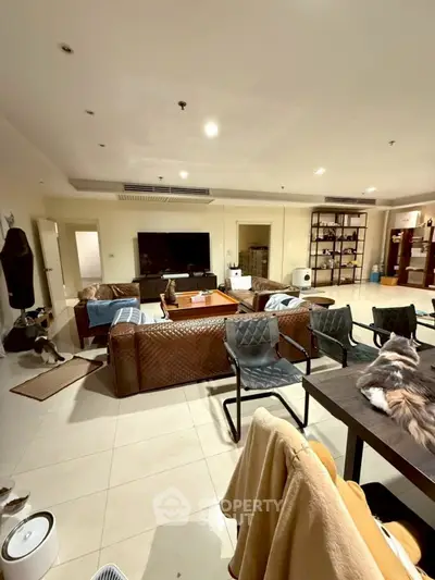 Spacious living room with modern furniture and open layout, perfect for entertaining.