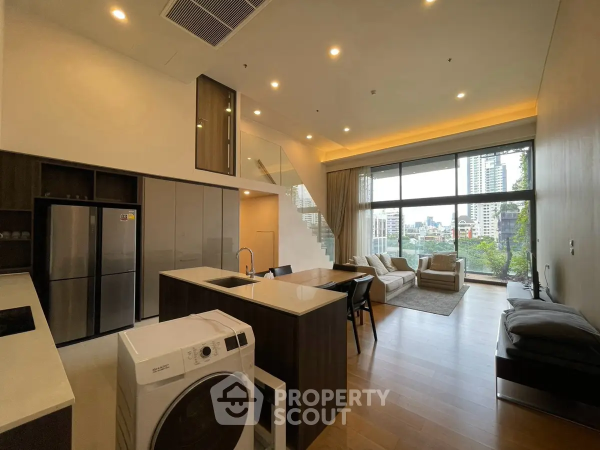 Luxurious modern living room with open kitchen and stunning city view