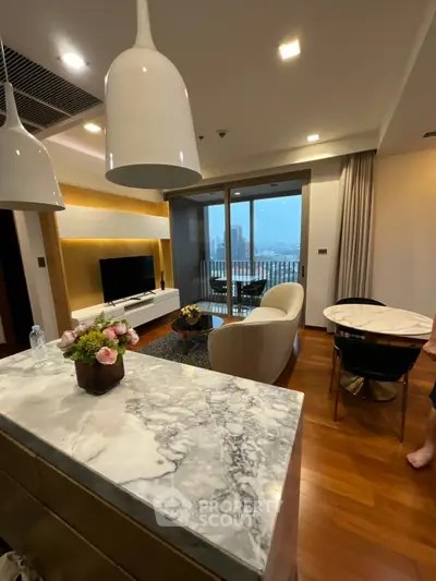 Luxurious modern living room with marble accents and city view balcony