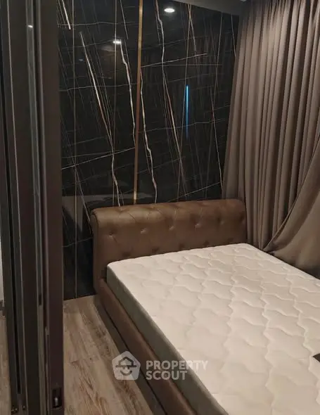 Modern bedroom with stylish dark accent wall and elegant curtains