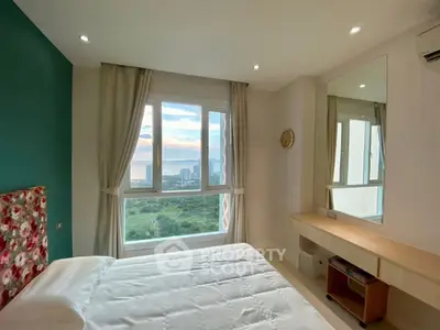 Bright bedroom with stunning city view and modern decor