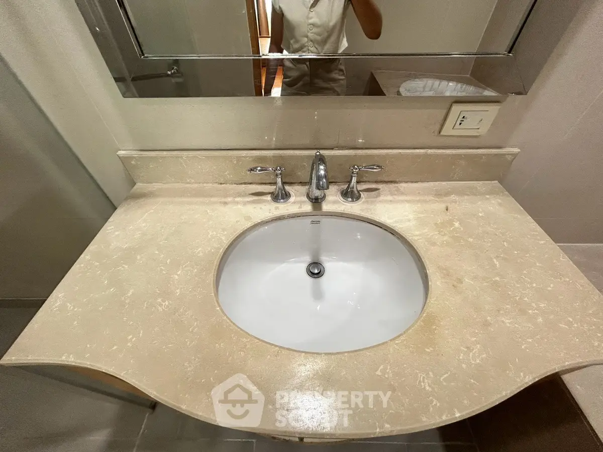Elegant bathroom sink with marble countertop and modern fixtures