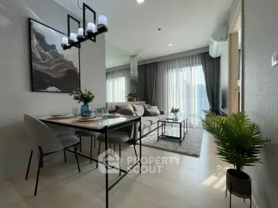 Modern living room with elegant dining area, stylish decor, and abundant natural light.