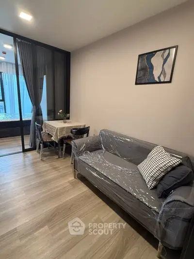 Modern living room with stylish decor and cozy seating area in a contemporary apartment.