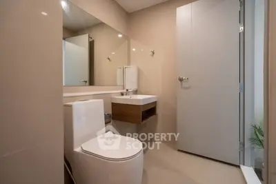 Modern bathroom with sleek fixtures and minimalist design in a contemporary home.