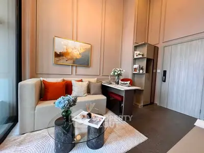 Modern living room with stylish decor, cozy sofa, and elegant wall art in a chic apartment.