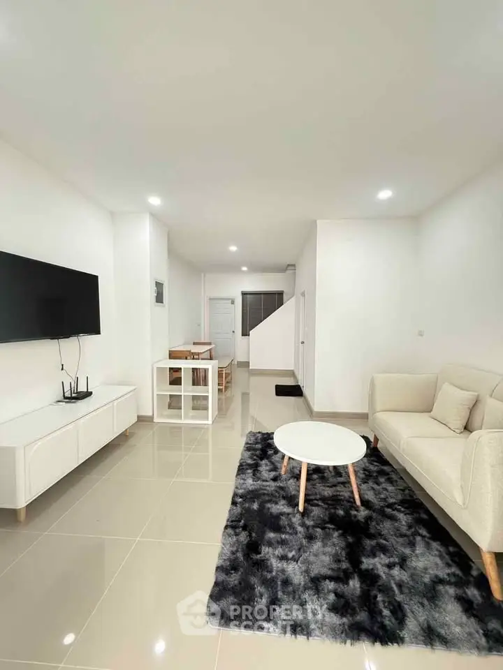 Modern living room with sleek furniture and open layout, perfect for contemporary living.