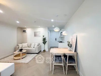 Modern living room with cozy seating and stylish dining area