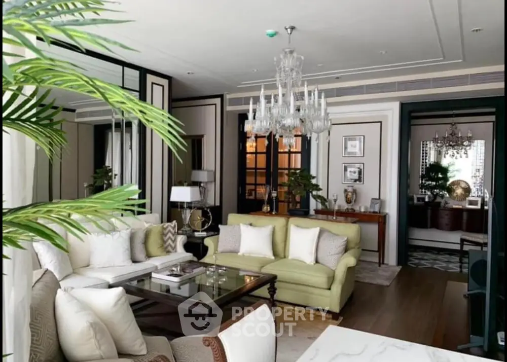 Luxurious living room with elegant chandelier and stylish decor
