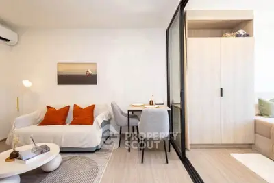 Modern living room with cozy seating and stylish decor in a contemporary apartment.
