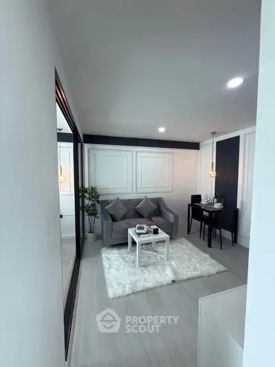Modern living room with elegant decor and cozy seating area