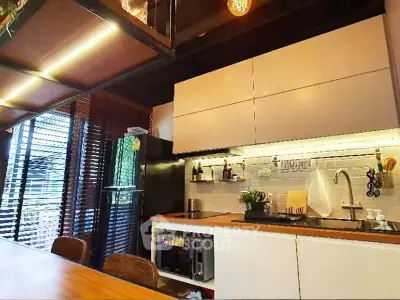 Modern kitchen with sleek cabinets and under-cabinet lighting