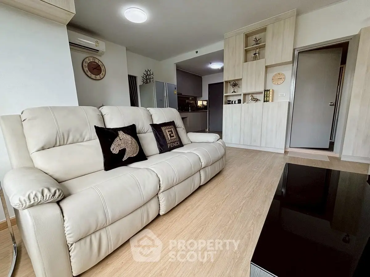 Modern living room with stylish decor and comfortable seating in a contemporary apartment.