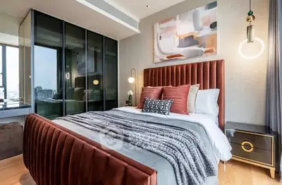 Luxurious bedroom with modern decor and large glass wardrobe