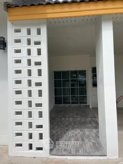 Modern entrance with stylish brickwork and sleek tiled flooring