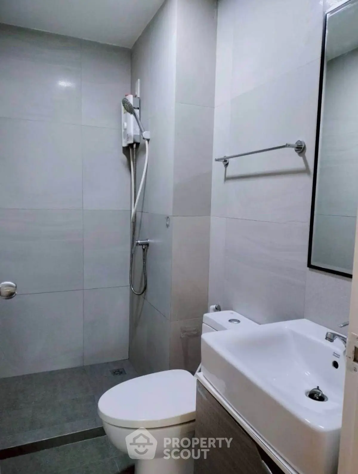 Modern bathroom with sleek fixtures and minimalist design in a contemporary apartment.