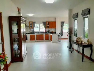 Spacious kitchen with modern cabinetry and open layout, perfect for entertaining.
