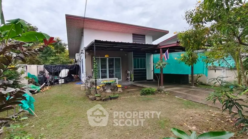 Charming single-story home with spacious garden and covered patio area.