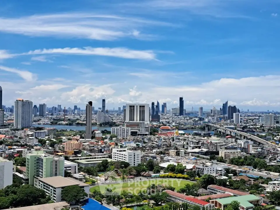 Stunning cityscape view showcasing a vibrant urban skyline with modern high-rise buildings and lush greenery.