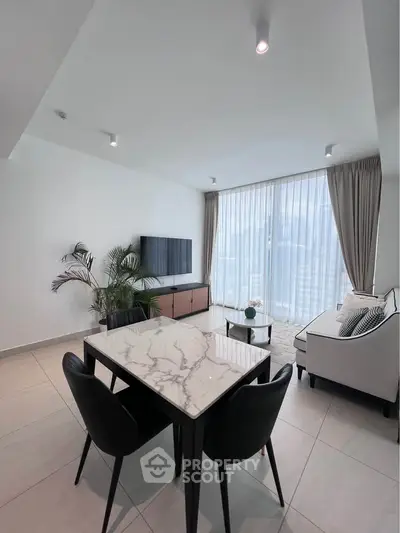 Modern living room with marble dining table and large window view