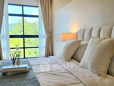 Luxurious bedroom with plush bedding and scenic window view
