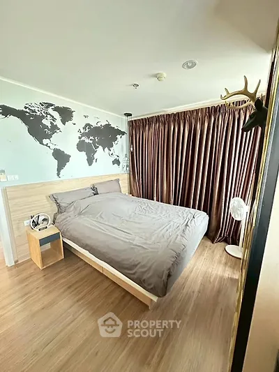Modern bedroom with world map wall art and elegant curtains