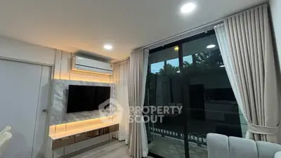 Modern living room with large window and stylish decor