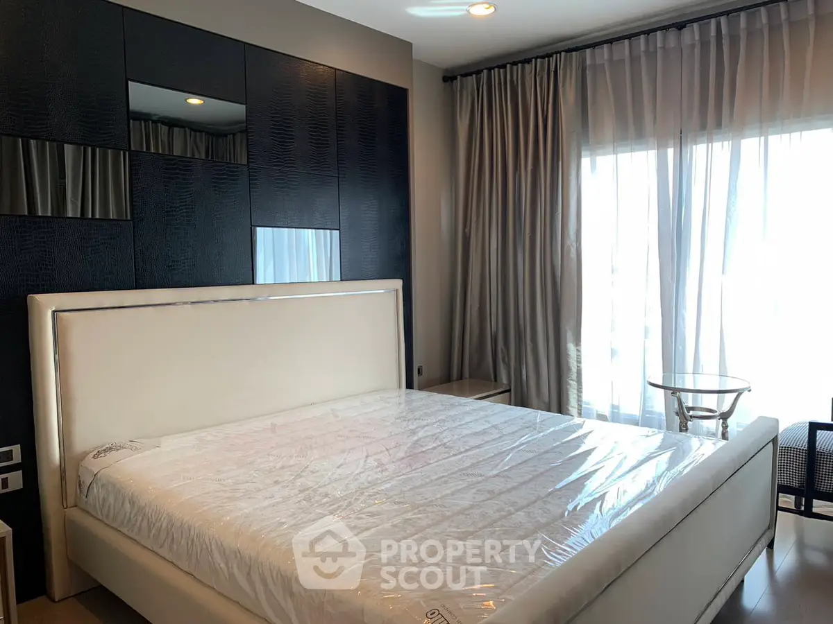 Modern bedroom with large bed and stylish decor