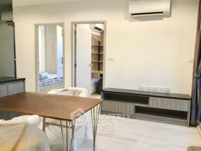 Modern apartment interior with air conditioning and stylish furniture