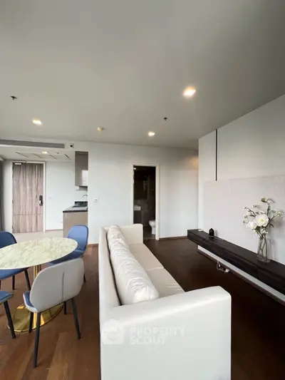Modern living room with elegant decor and open kitchen layout