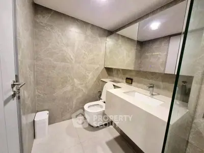 Modern bathroom with sleek design and elegant fixtures in a luxury apartment.