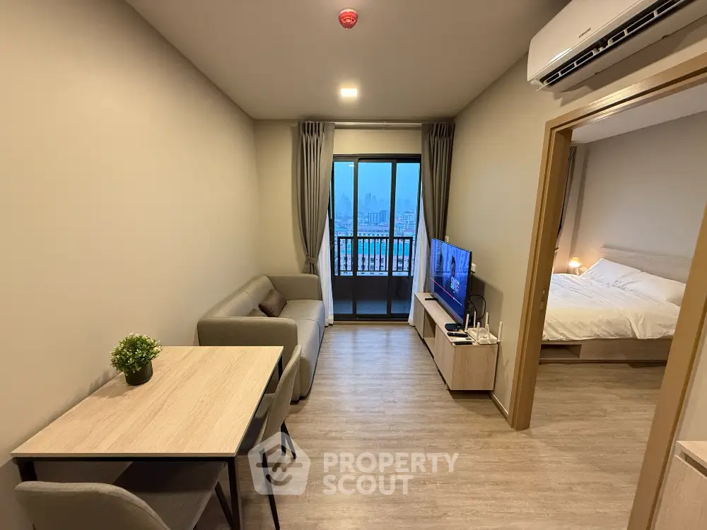 Modern apartment living room with balcony and city view