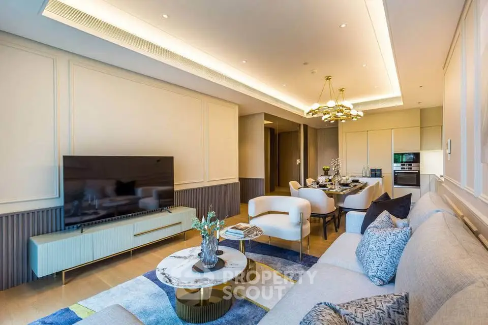 Luxurious modern living room with elegant decor and open dining area, featuring stylish furniture and ambient lighting.