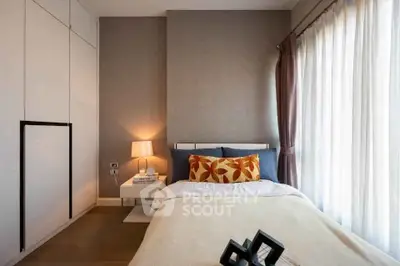 Cozy modern bedroom with stylish decor and natural light