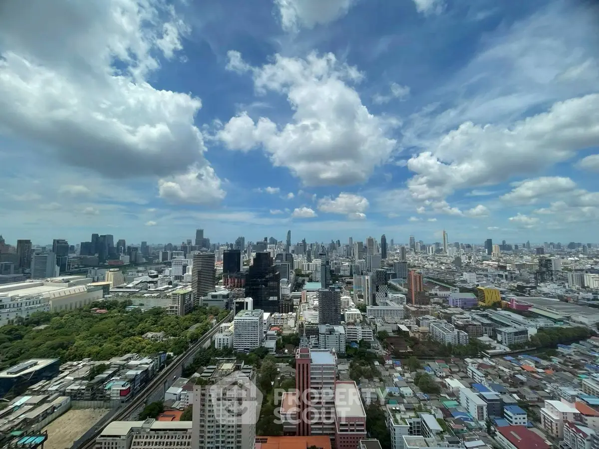 Stunning cityscape view from a high-rise building showcasing urban skyline and vibrant city life.